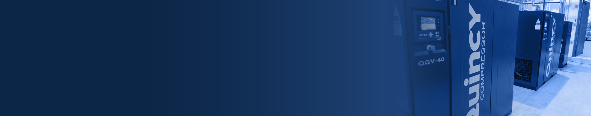 Quincy air compressors in a line on a factory floor with dark blue overlay