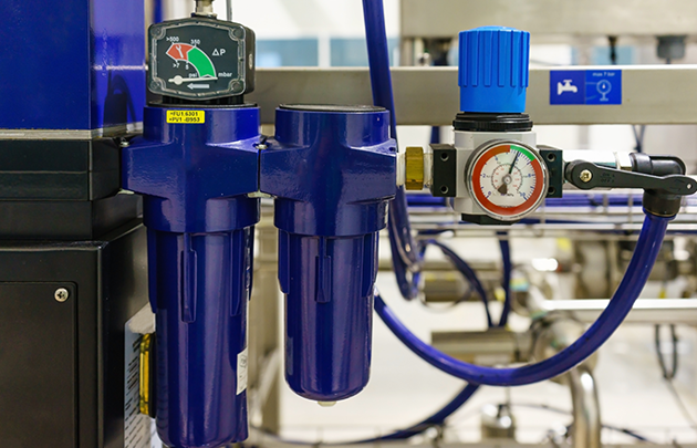 A blue air filter machine equipped with a gauge and a hose, suggesting functionality for air measurement or transfer.