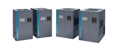 4 Atlas copco dark grey air compressors in a line