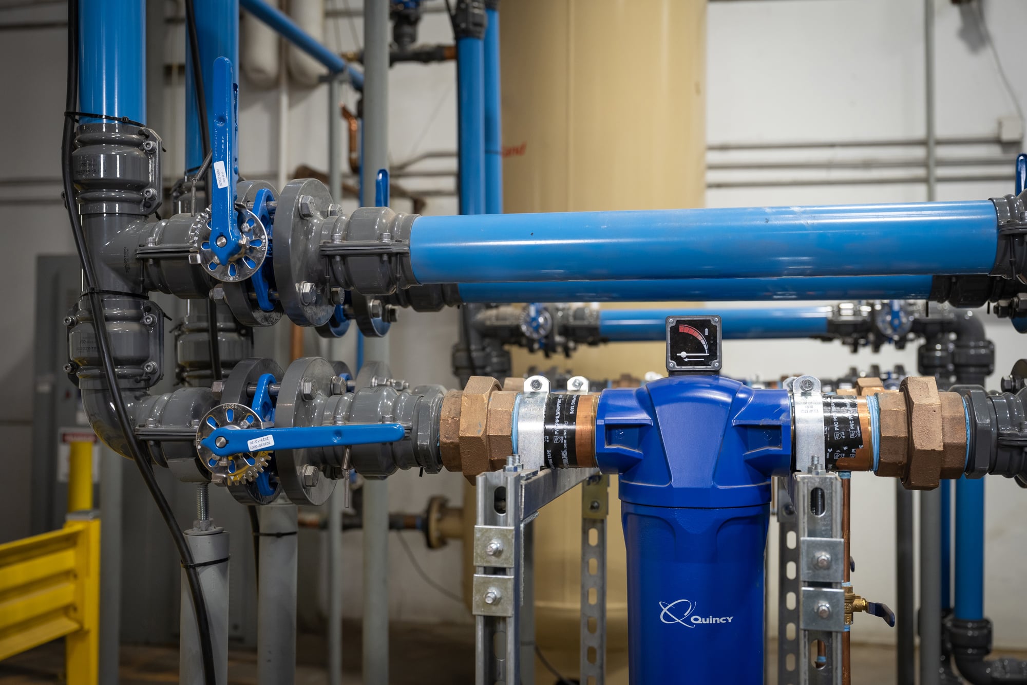 compressed air piping in factory with elbows and fittings
